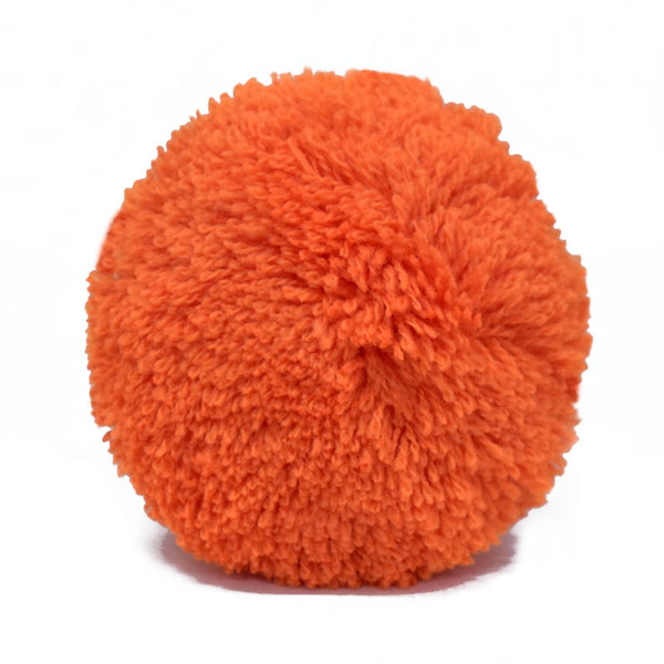 Orange pom pom for decorating bags