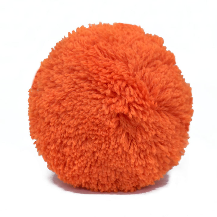 Orange pom pom for decorating bags