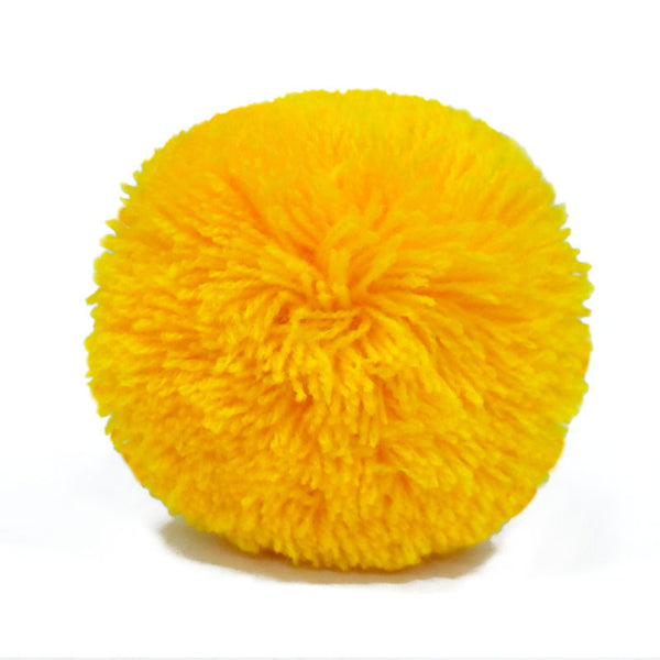 Yellow pom pom for decorating bags