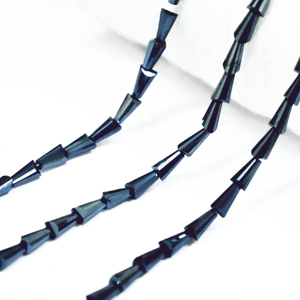 EMBFCB5403 (4x7MM Cone Faceted Crystal Beads in Gunmetal Color)