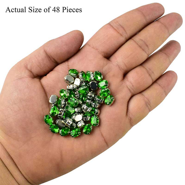 emerald green crystal in setting