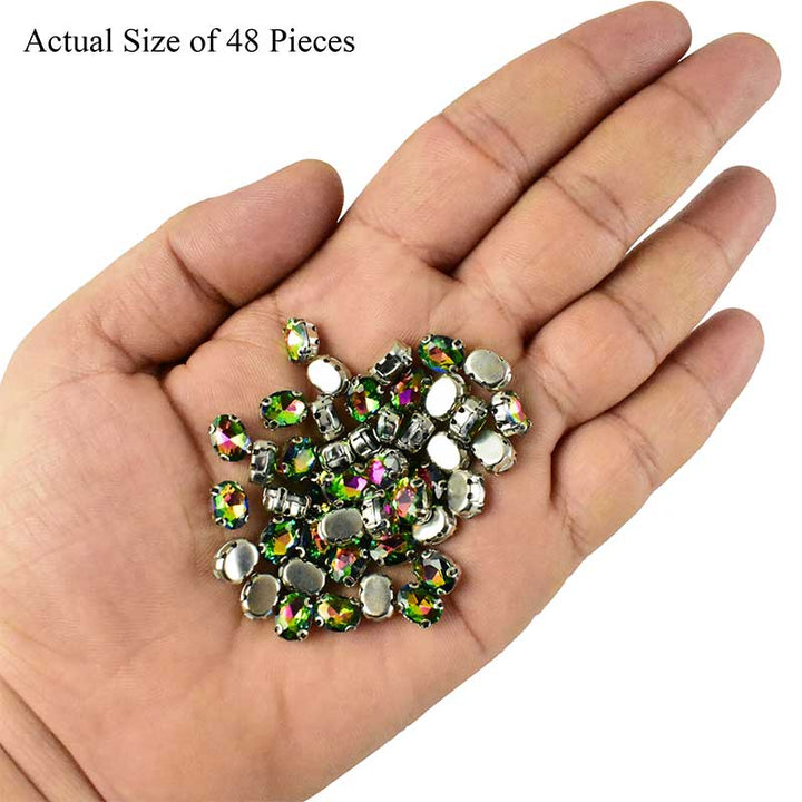 Green rainbow crystal in setting
