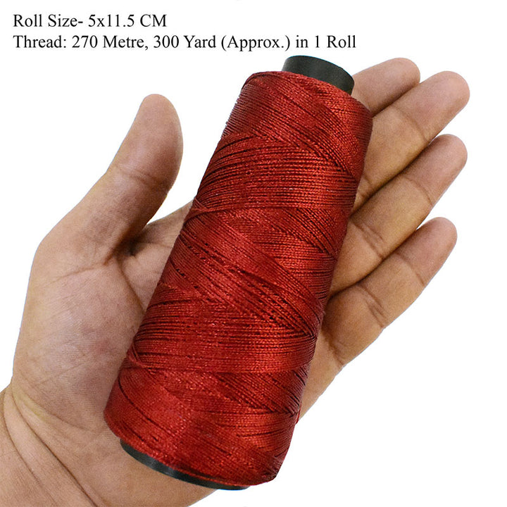 red metal thread spool