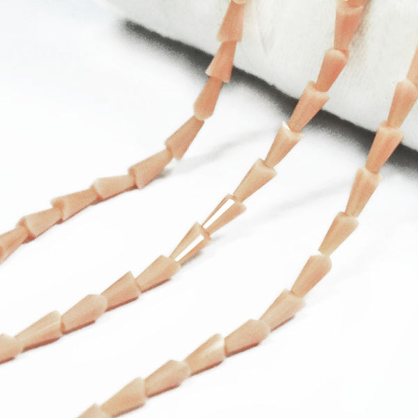 EMBFCB5395 (4x7MM Cone Faceted Crystal Beads in Peach Color)