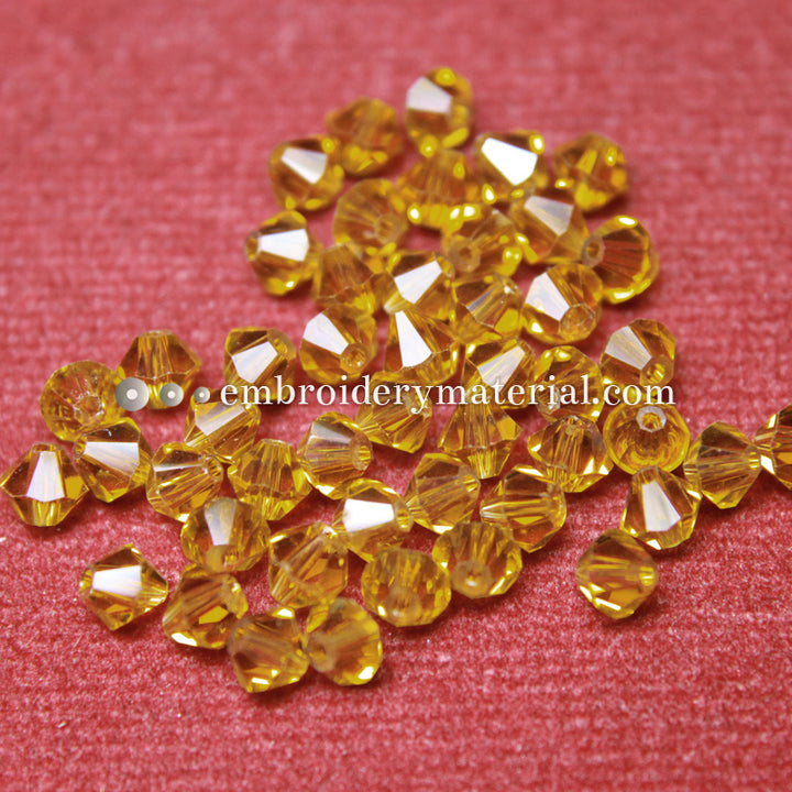 Gold colour bicone crystrals