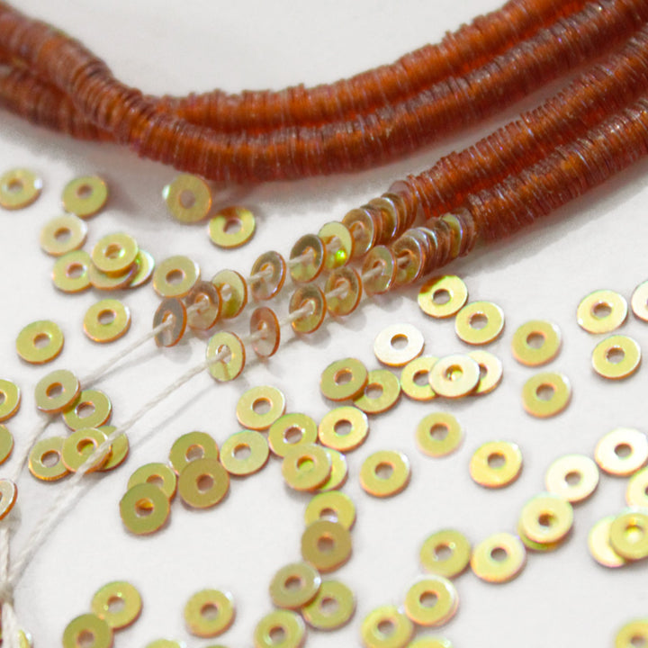 gold sequins strung